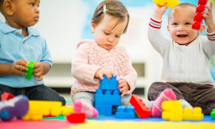 When do toddlers start playing with each other
